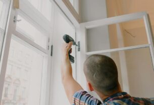 A carpenter doing window replacement