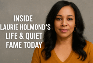 Laurie Holmond in a mustard sweater, smiling calmly