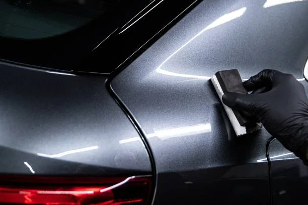 Professional Car Detailers and Security Guards in Action